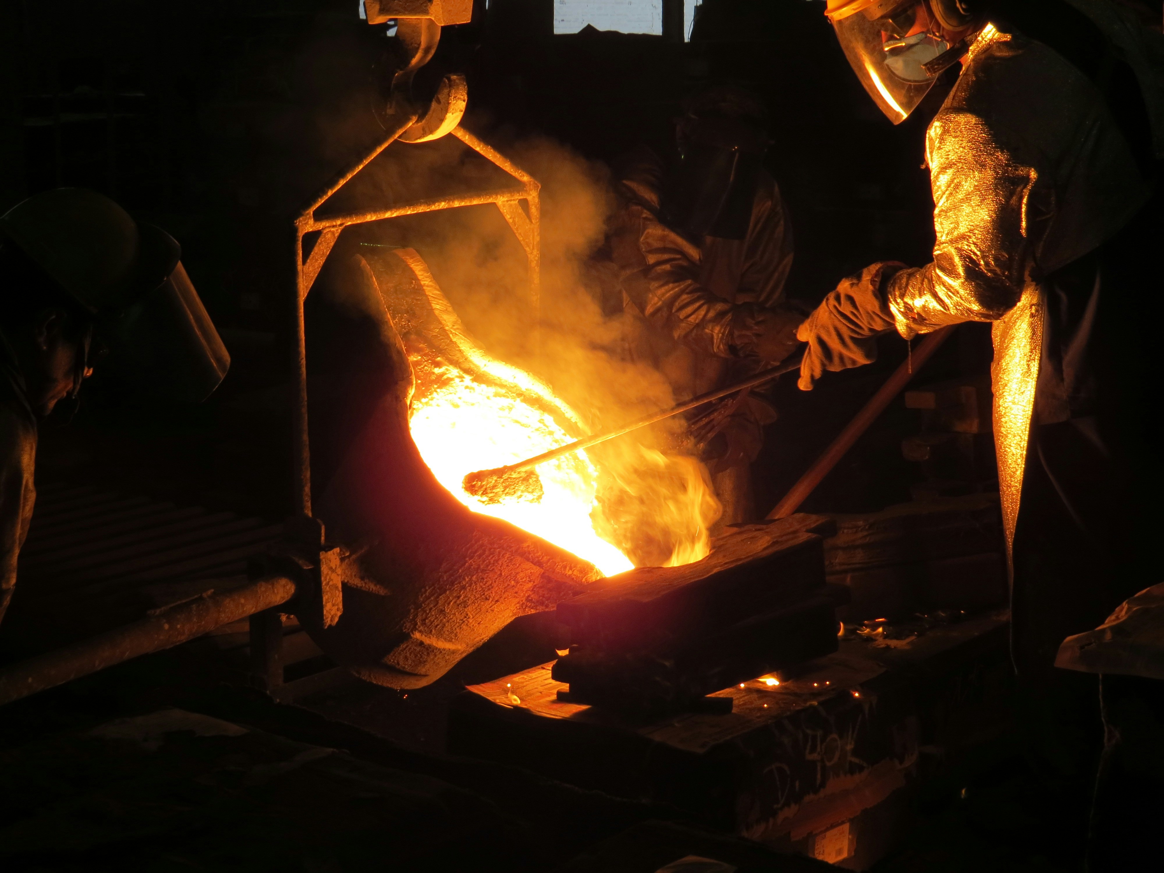 A moulder working on a cast